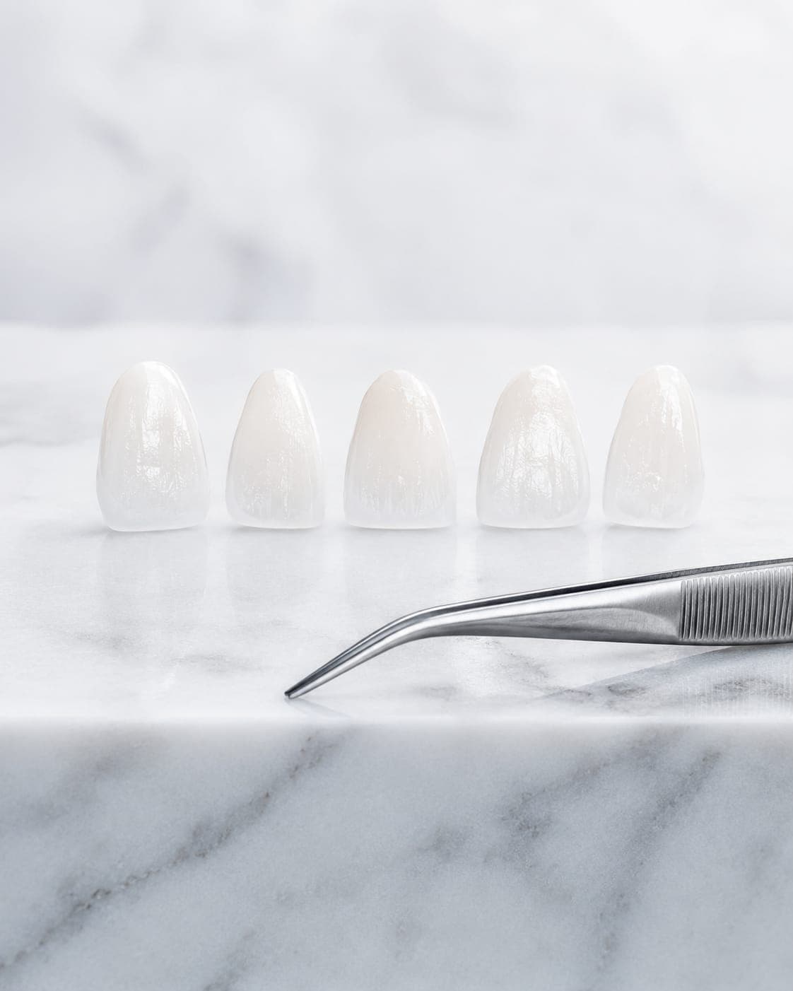 Veneers — a set of porcelain facings on a stone slab before fitting