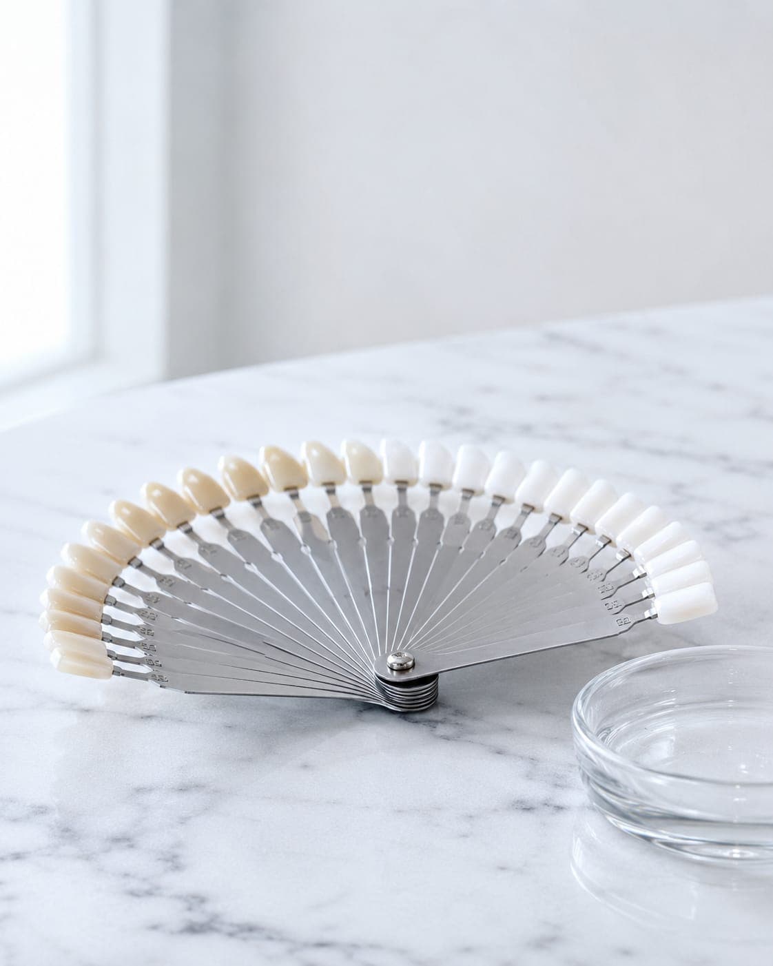 Whitening — a polished enamel sphere under a cool studio beam