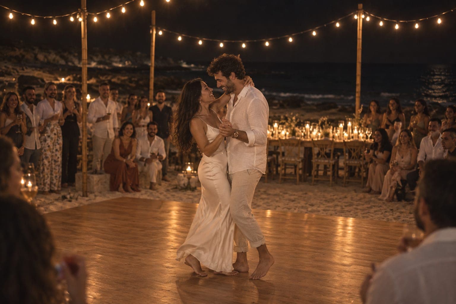 Rana and Ziad dancing barefoot on boards laid over the sand