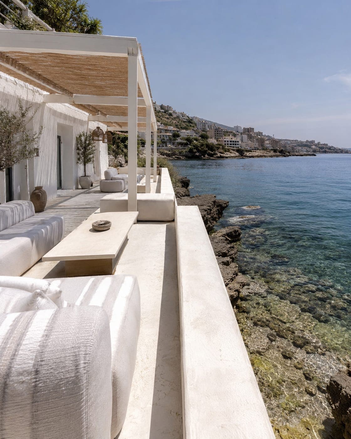 A white terrace over rocks and clear water